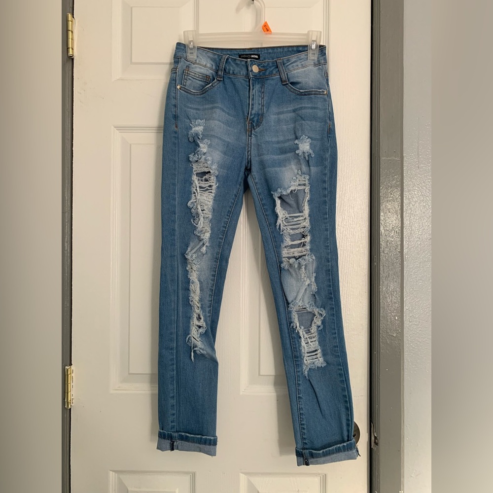 Light wash skinny jeans with slit on the back